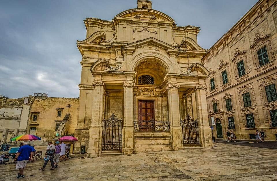 Historic limestone church and surrounding buildings in Malta
