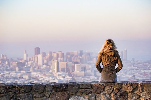 A woman who solo travels enjoys the cityscape