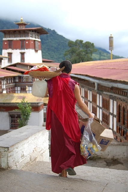 Monk near monastery in Bhutan mountains