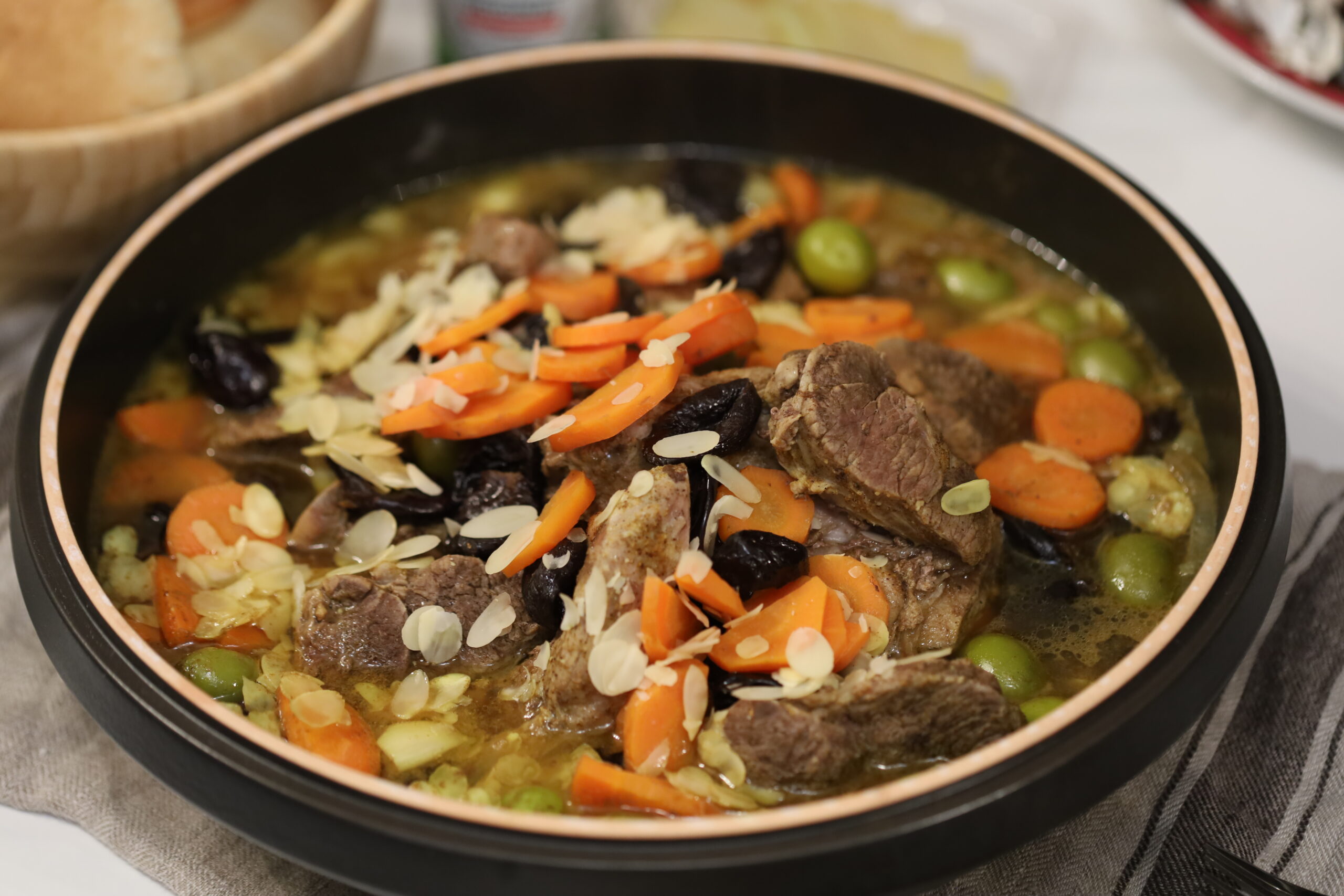 Traditional Moroccan tajine served in earthenware dish