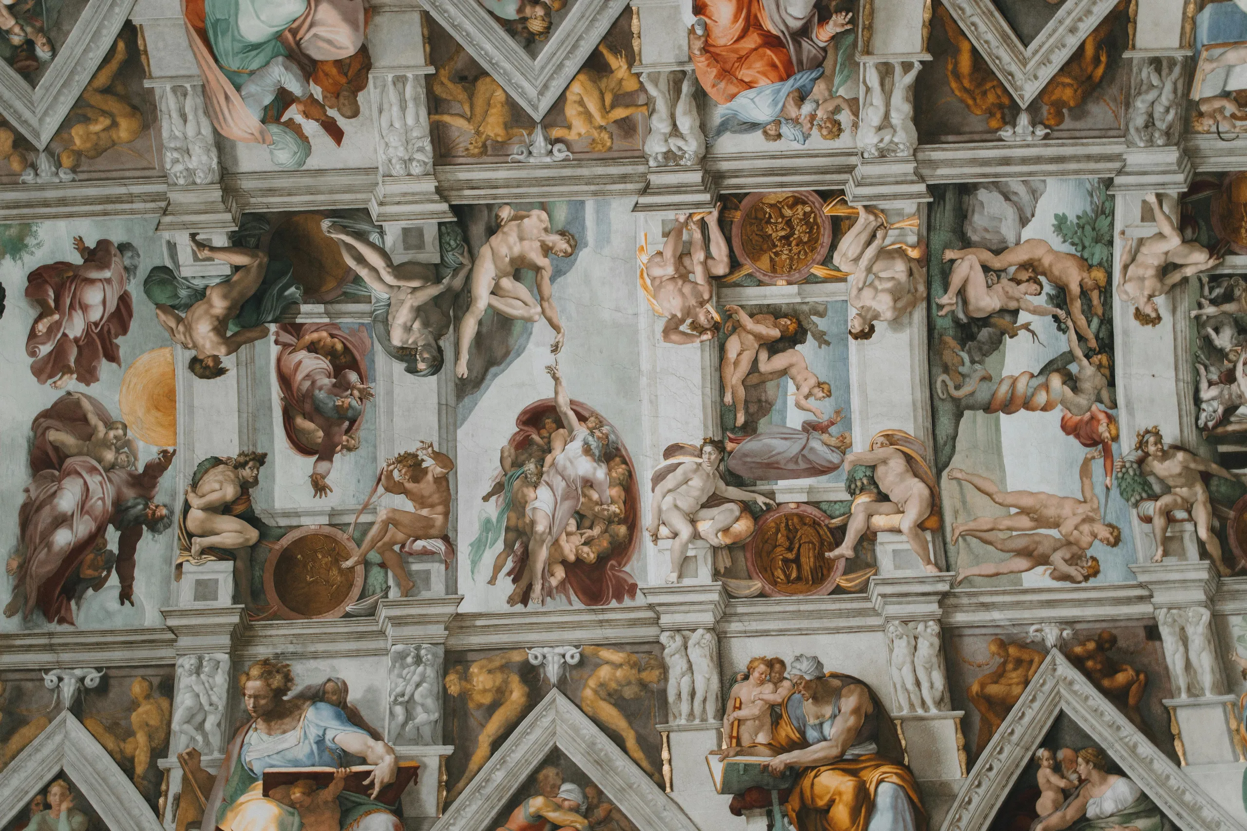 Vatican: Sistine Chapel ceiling by Michelangelo showing detailed biblical frescoes and vibrant Renaissance art
