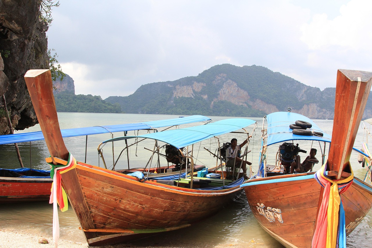 Traditional boats and tropical coastline in Southeast Asia
