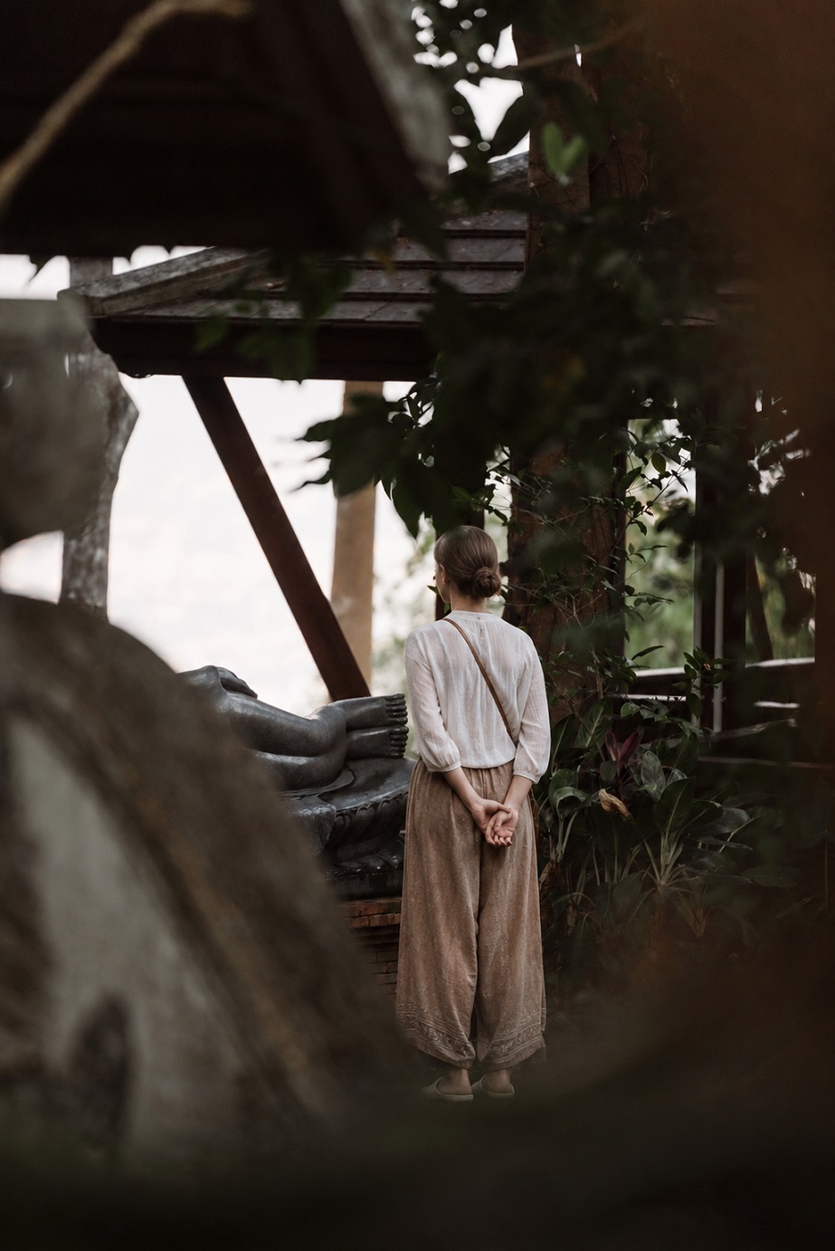 Traveller showing respect at a sacred site by following local customs