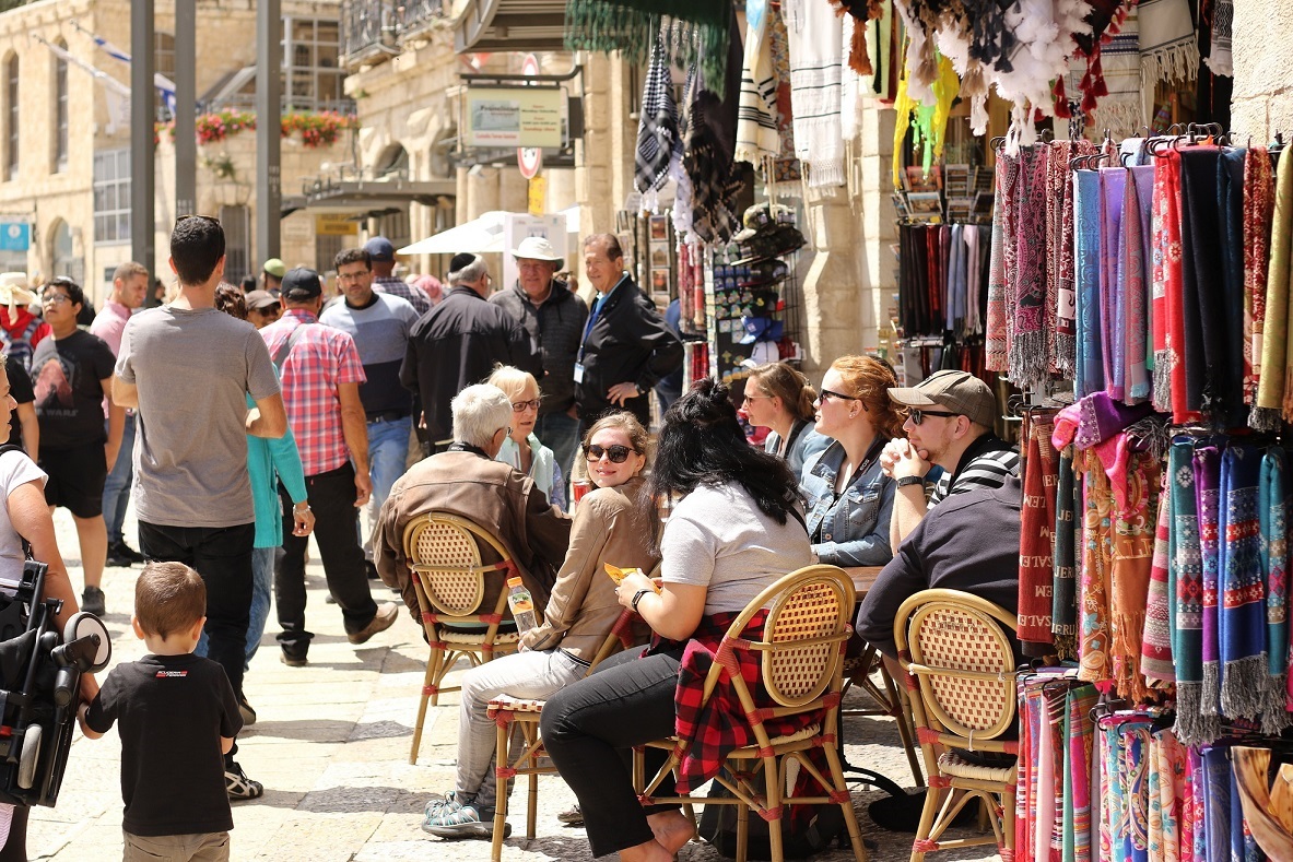 Traveller socialising easily with locals while respecting cultural differences