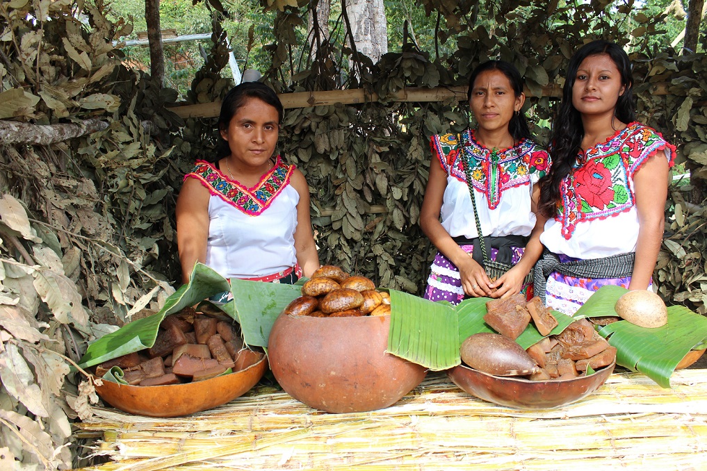 Women presenting food in Oaxaca