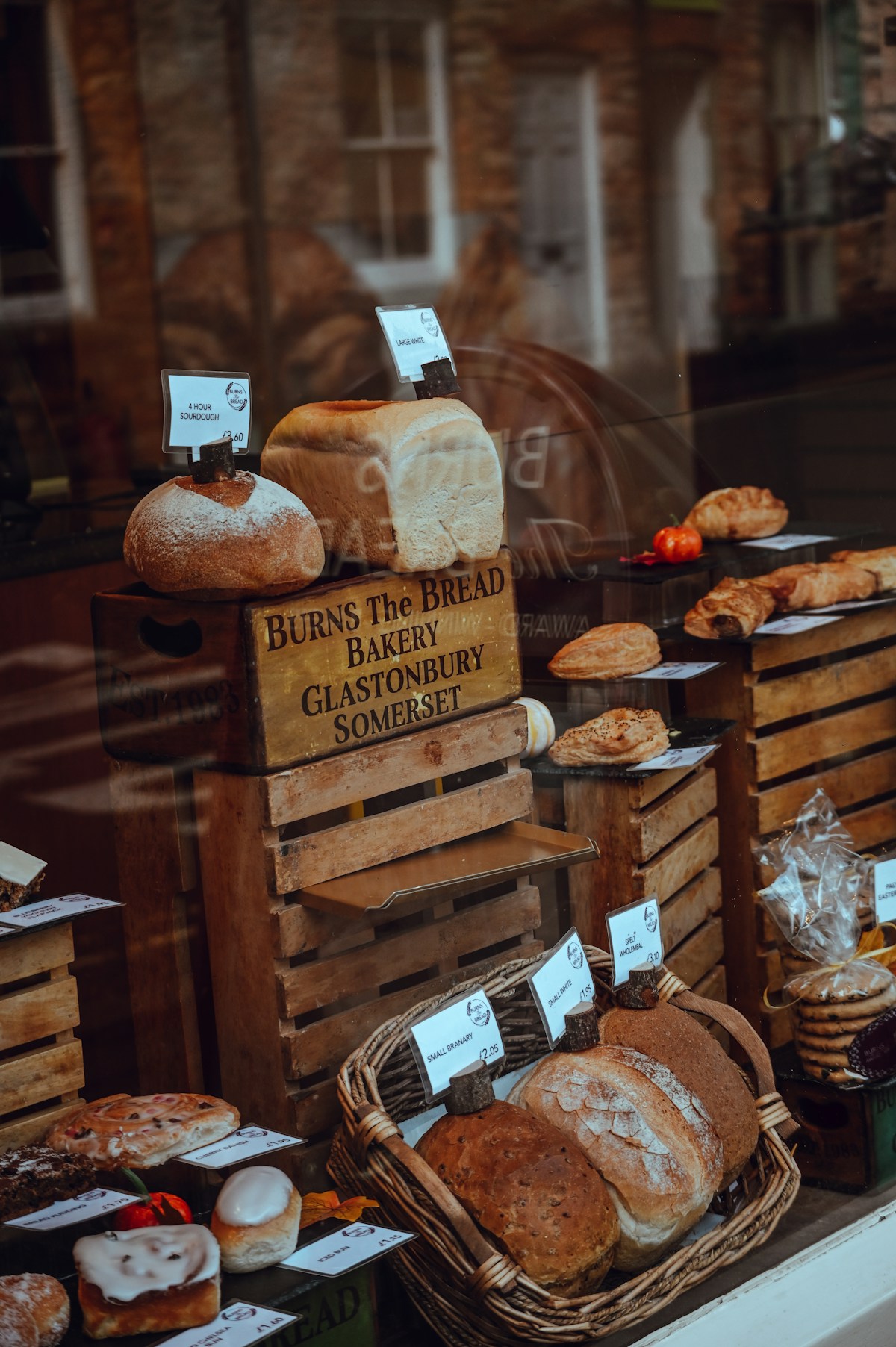 Bread loaves and pastries displayed in the window of Burns the Bread bakery