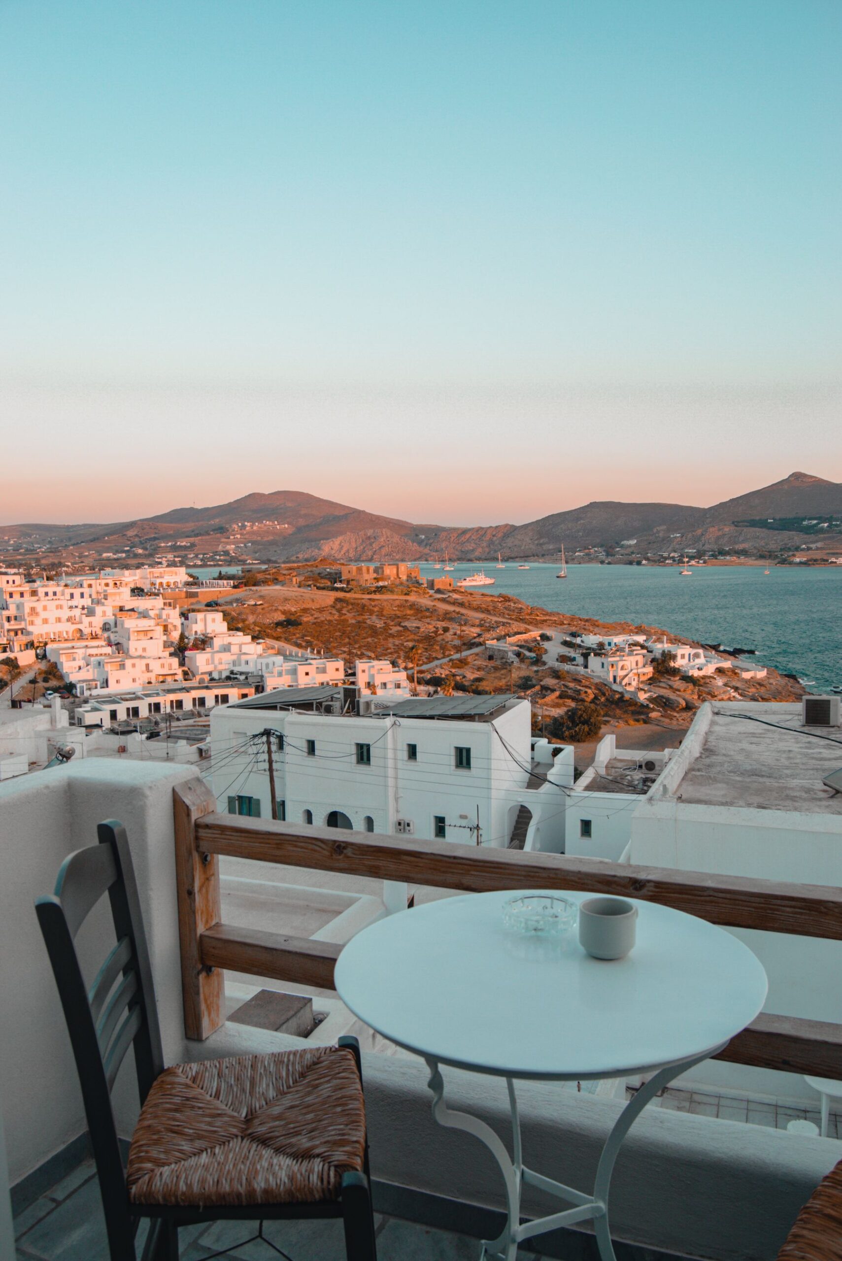 Terrace overlooking white houses and the sea on Paros